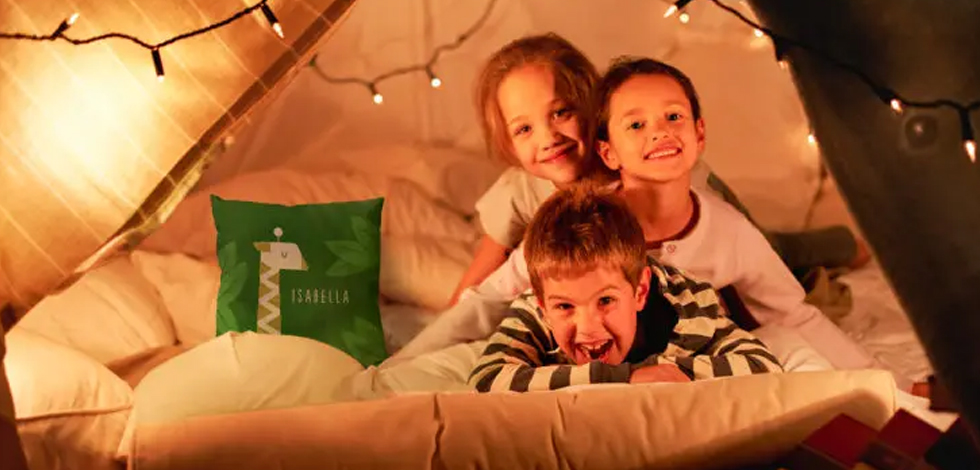 Plan an epic backyard campout with personalized pillows, blankets, and more!