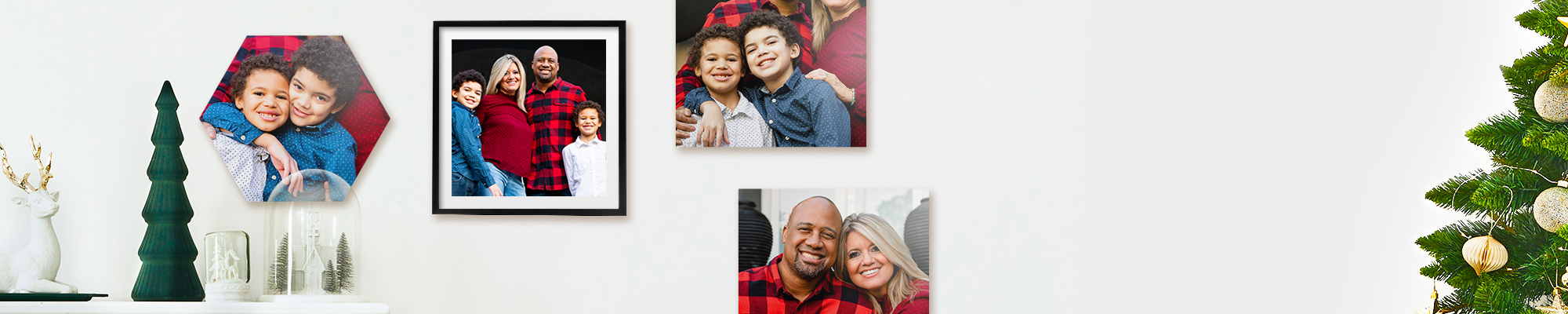 Snapfish Photo Tiles featuring child portraits, family photos, and vacation photos displayed on wall above a sofa