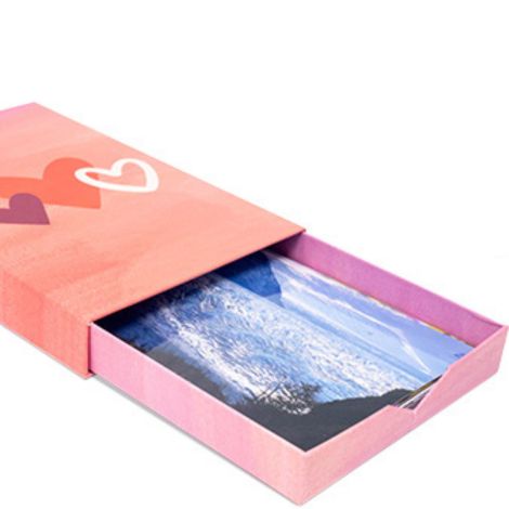 Pink photo box with prints 