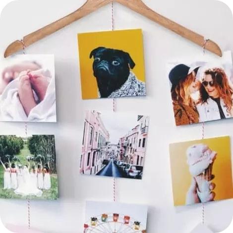 7 square prints displayed on a hanger 